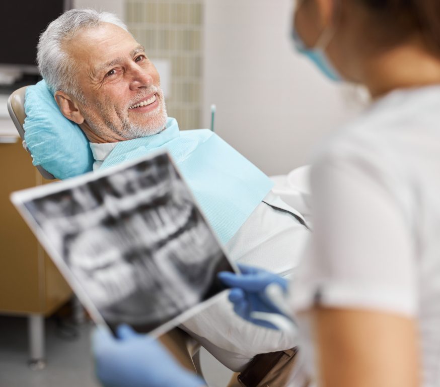 dentist helping dental patient at Coquitlam centre dental office
