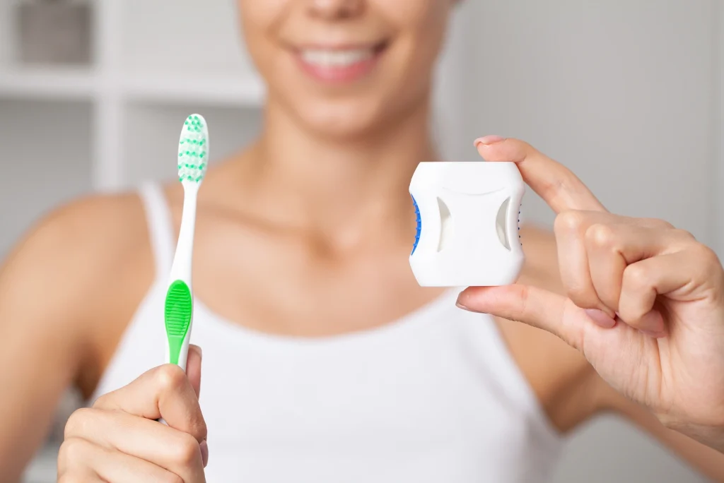 dental cleaning with toothbrush and floss