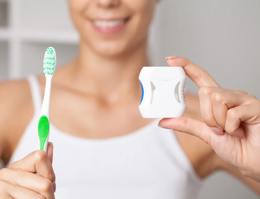 dental cleaning with toothbrush and floss