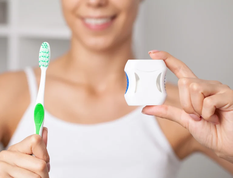 dental cleaning with toothbrush and floss